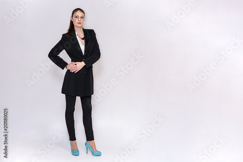 beautiful girl in business suit on white background in different poses
