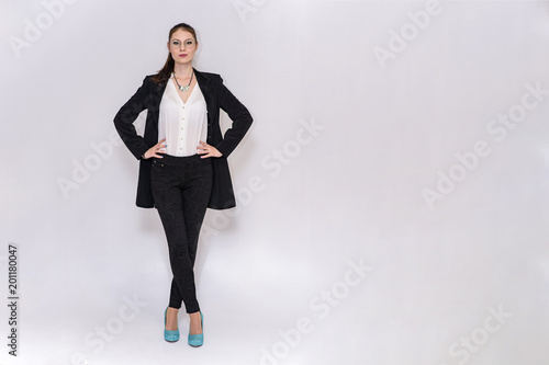 beautiful girl in business suit on white background in different poses