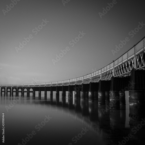 the Tay bridge going over the river Tay on a calm day