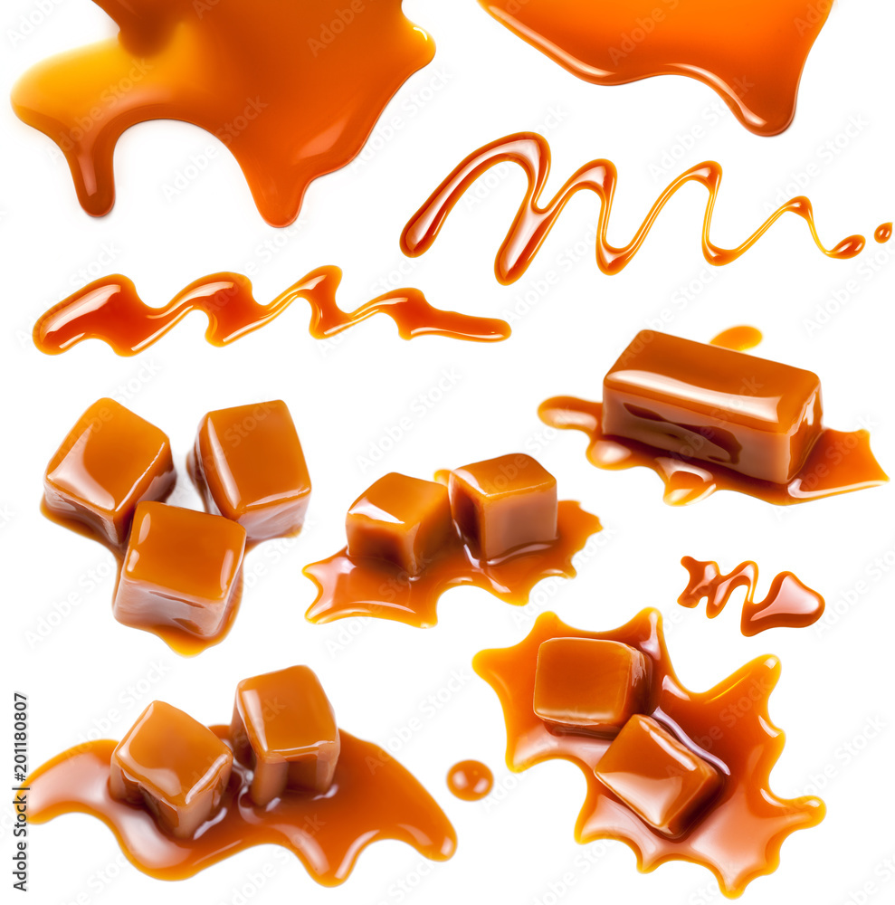 Flowing caramel sauce isolated on white background. Golden Butterscotch toffee caramel liquid . Flowing caramel sauce isolated on white background. Golden Butterscotch toffee caramel liquid .