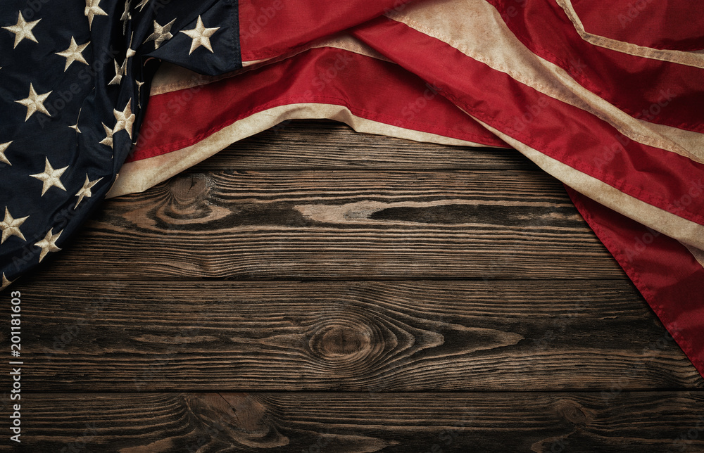 Obraz premium Old USA flag on wooden background with copy space