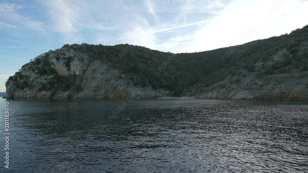 Cliffs covered with forest on the shore Cliffs covered with forest on the shore