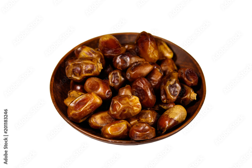 Dried date fruits in ceramic plate isolated on white background Dried date fruits in ceramic plate isolated on white background