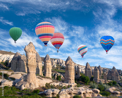 Colorful hot air balloons flying over Love valley in Cappadocia, Anatolia, Turkey