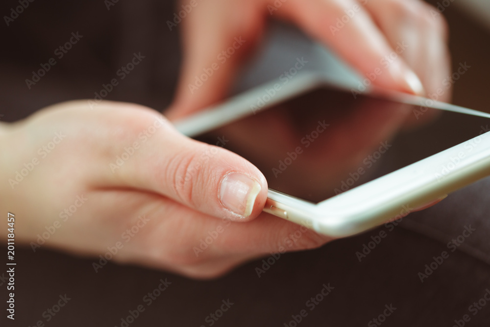Woman typing write message on smart phone Woman typing write message on smart phone