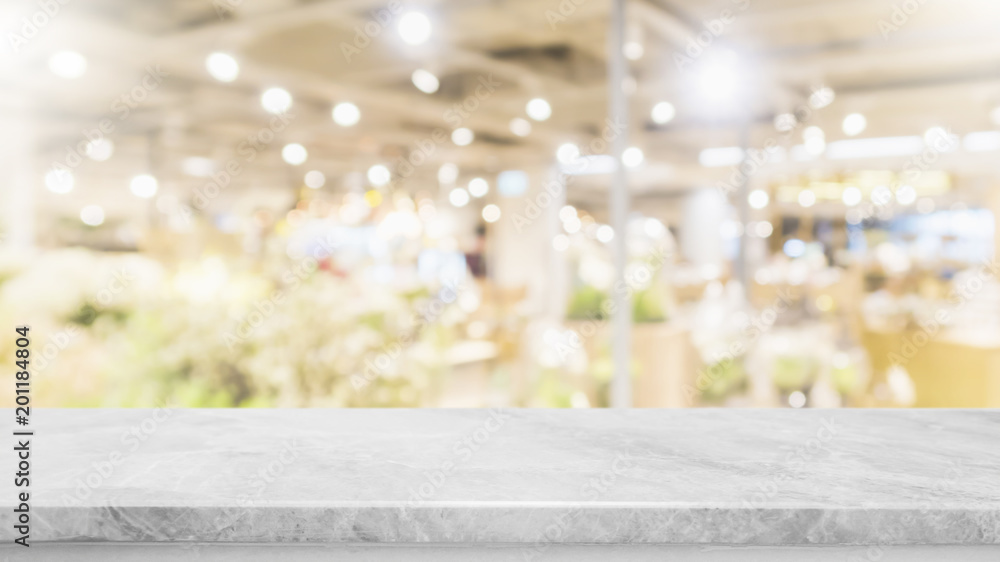 Empty marble stone table top on blurred with bokeh shopping mall background - can be used for display or montage your products Empty marble stone table top on blurred with bokeh shopping mall background - can be used for display or montage your products