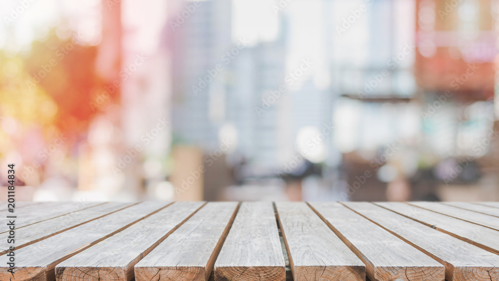 Empty wood table top and blurred restaurant interior background - can used for display or montage your products. Empty wood table top and blurred restaurant interior background - can used for display or montage your products.