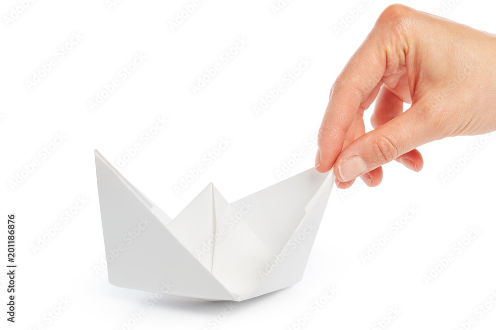 Naklejka premium Paper ship in a female hand