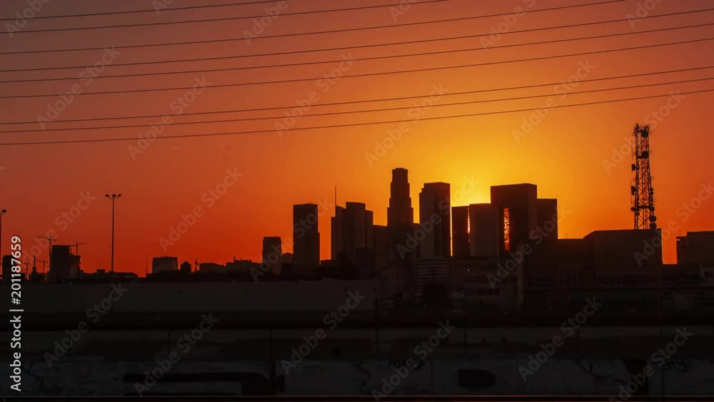 Cinematic hyperlapse ( time lapse in motion ) view of the skyscrapers at sunset with sunshine between buildings Cinematic hyperlapse ( time lapse in motion ) view of the skyscrapers at sunset with sunshine between buildings