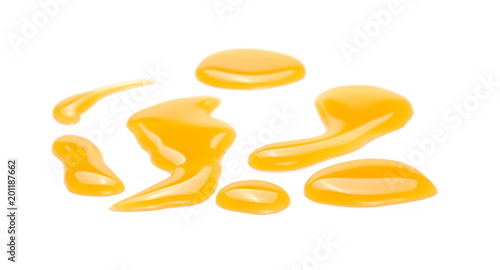 Puddle of orange juice isolated on white background, clipping path
