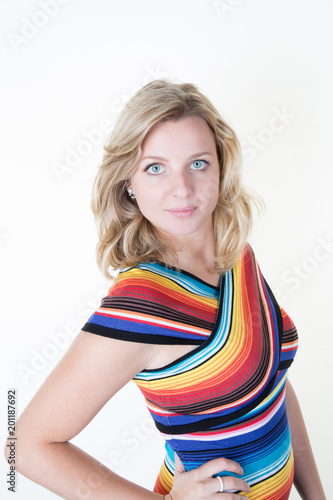 lifestyle fashion concept with beautiful blond woman wearing casual clothes posing on white background