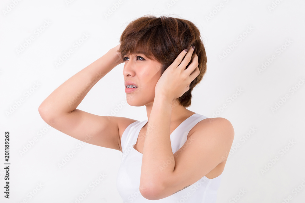 Health and pain. Stressed exhausted young woman having strong tension headache. Isolated on white background. Studio lighting. Concept for healthy and medical Health and pain. Stressed exhausted young woman having strong tension headache. Isolated on white background. Studio lighting. Concept for healthy and medical
