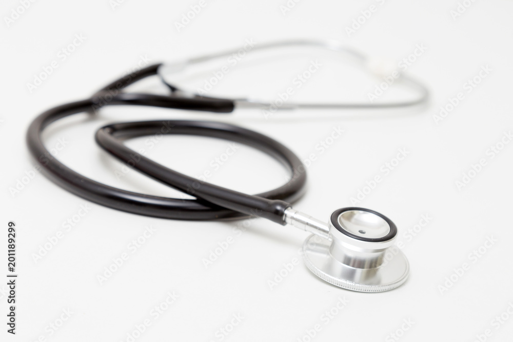 Stethoscope on table. Isolated on white background. Studio lighting. Concept for healthy and medical Stethoscope on table. Isolated on white background. Studio lighting. Concept for healthy and medical