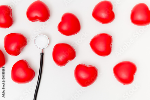 Red heart and a stethoscope. Isolated on white background. Studio lighting. Concept for healthy and medical