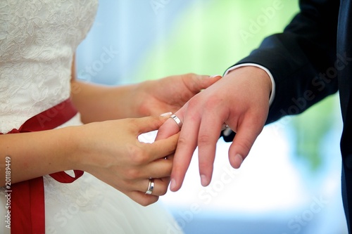 The bride and groom put the ring on the wedding ceremony