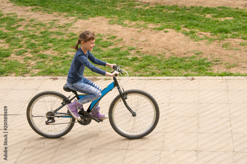 Girl rides a bike