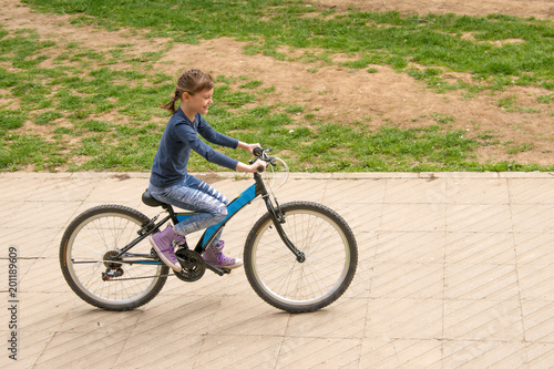 Girl rides a bike