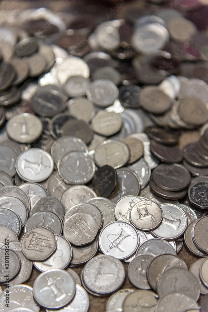 A pile of Dirham coins vertical A pile of Dirham coins vertical