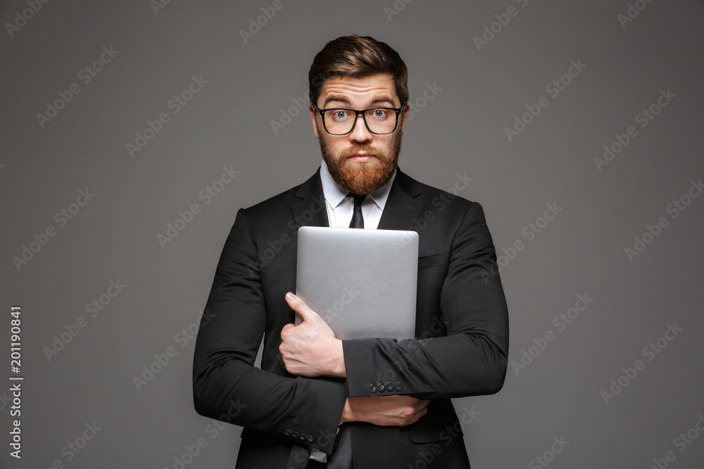 Portrait of a confused young businessman Portrait of a confused young businessman