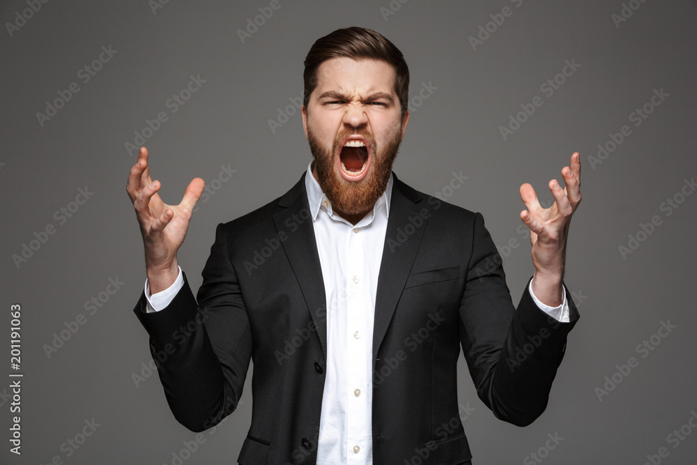 Portrait of an angry young businessman