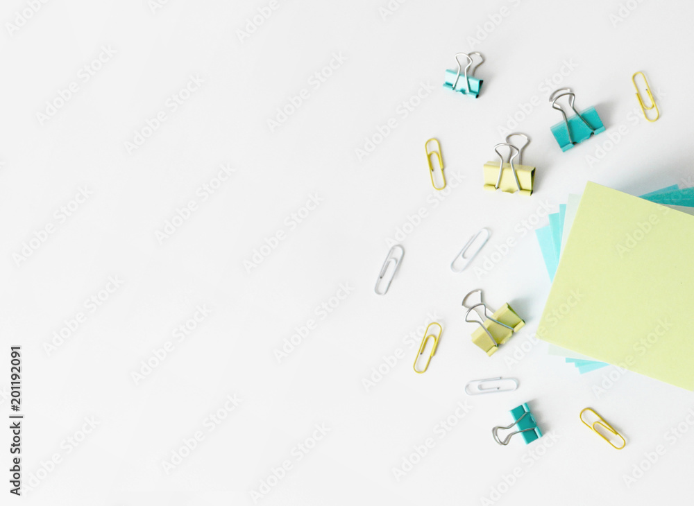 Office table with note papers and paper clips top view Office table with note papers and paper clips top view