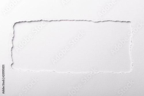 Ripped white paper with colored background with space for text