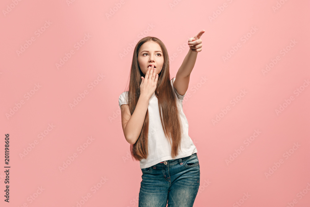 Beautiful teen girl looking suprised isolated on pink Beautiful teen girl looking suprised isolated on pink