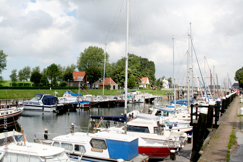 Ships and boats are mooring in the harbor of Veere