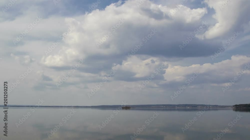 Clouds over the lake, timelapse. The movement of clouds over a spring lake.
Clouds over the lake, timelapse. The movement of clouds over a spring lake.