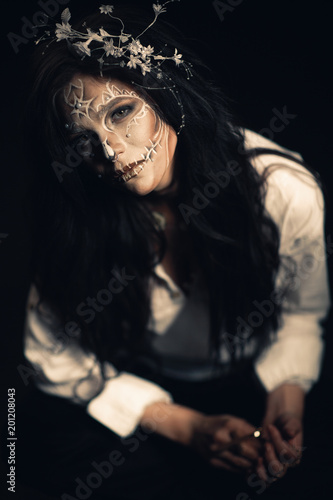 Girl with a stylized make-up of a dead bride