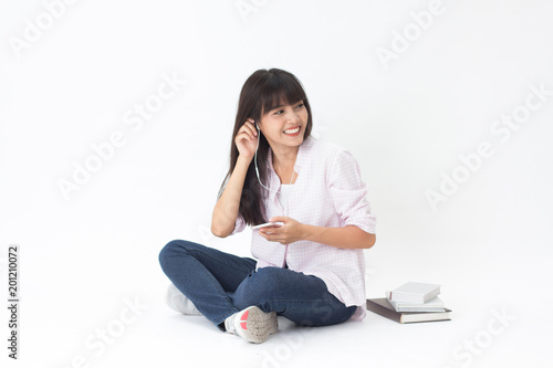 Beautiful Thai girl learning online sitting on white background