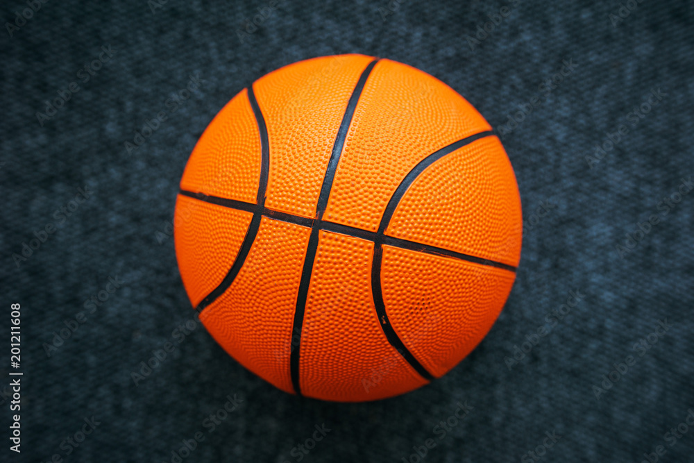Basketball ball on dark surface