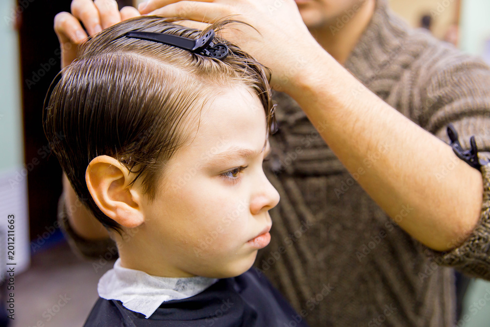 Fototapeta premium kid in barbershop