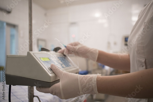 doctor with an infusion in the hospital, intensive care unit