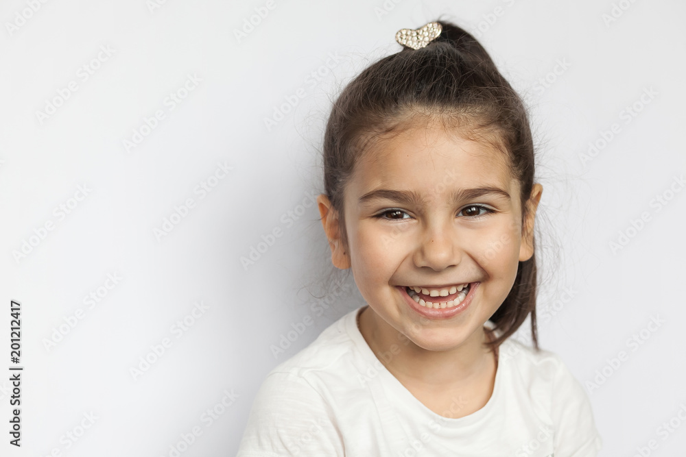 Portrait of happy cute brunette child girl on white background Portrait of happy cute brunette child girl on white background