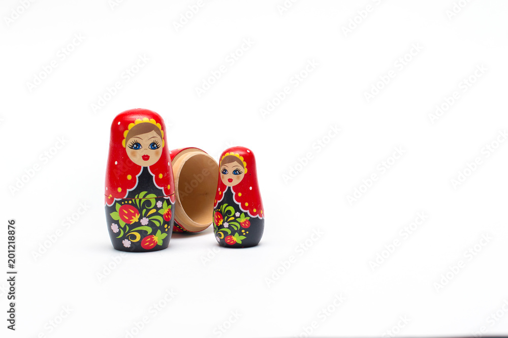 Traditional wooden doll Matreshka (Babushka) isolated on a white background Traditional wooden doll Matreshka (Babushka) isolated on a white background