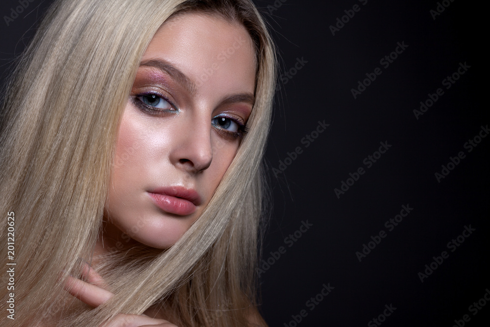 Portrait of a beautiful girl with makeup and hair