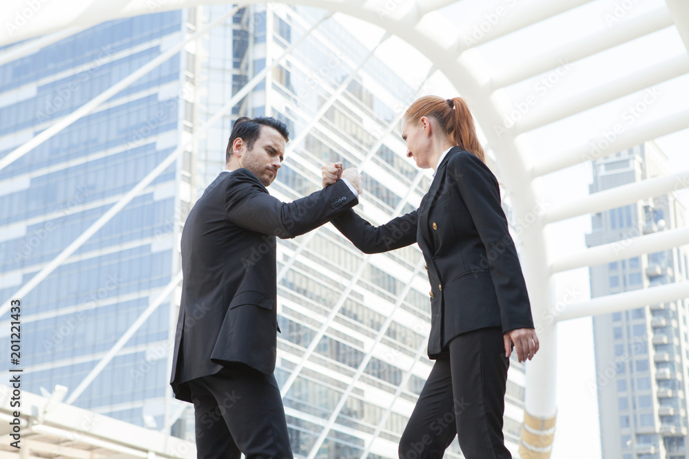 Young couple business people fighting for successful of business fighting concept. Young couple business people fighting for successful of business fighting concept.