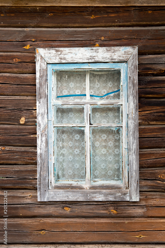 Simple blue Old wooden window on a wooden wall from an old lumber Simple blue Old wooden window on a wooden wall from an old lumber