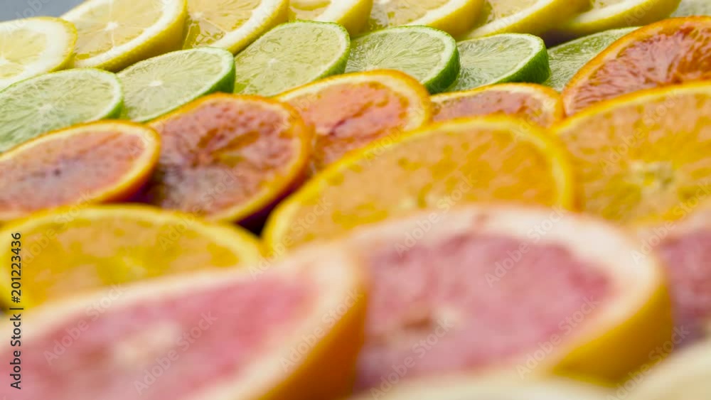 food, healthy eating and vegetarian concept - close up of grapefruit, orange, lemon and lime slices on table top food, healthy eating and vegetarian concept - close up of grapefruit, orange, lemon and lime slices on table top