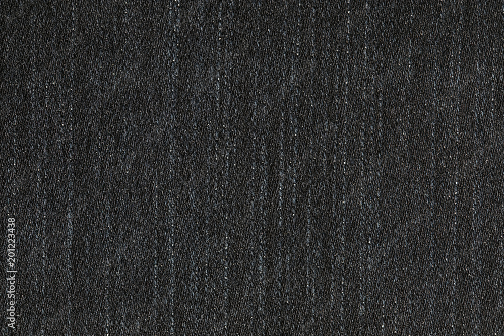 The black jeans fiber texture. The macro shot is made by means of stacking technology The black jeans fiber texture. The macro shot is made by means of stacking technology