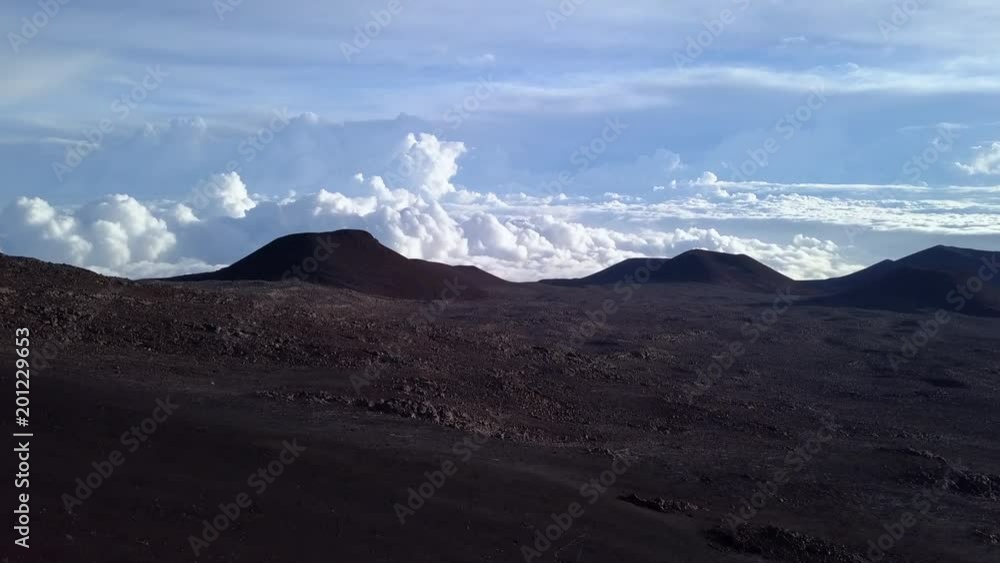 Sunrise clouds over the peak of Mauna Kea mountain, Hawaii. USA Sunrise clouds over the peak of Mauna Kea mountain, Hawaii. USA