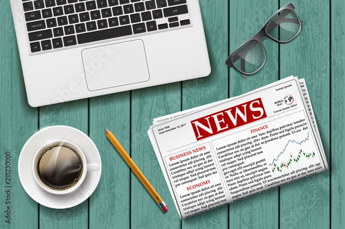 Newspaper with a cup of coffee