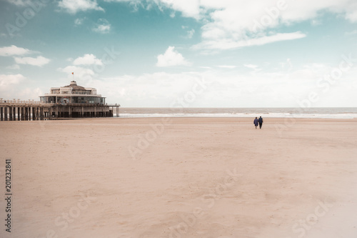Walk on the beach to the palace pier at Blankberg (Belgium) on the fascinating north sea