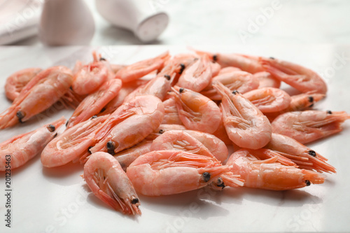 Fresh raw shrimps on board, closeup