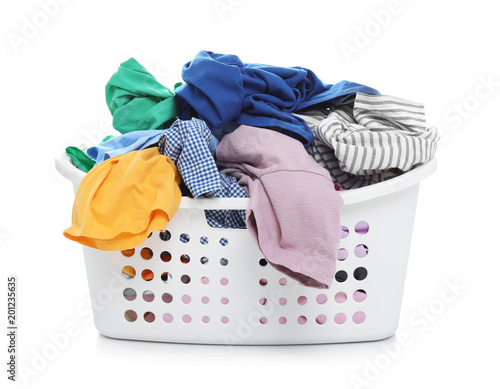 Laundry basket with dirty clothes on white background