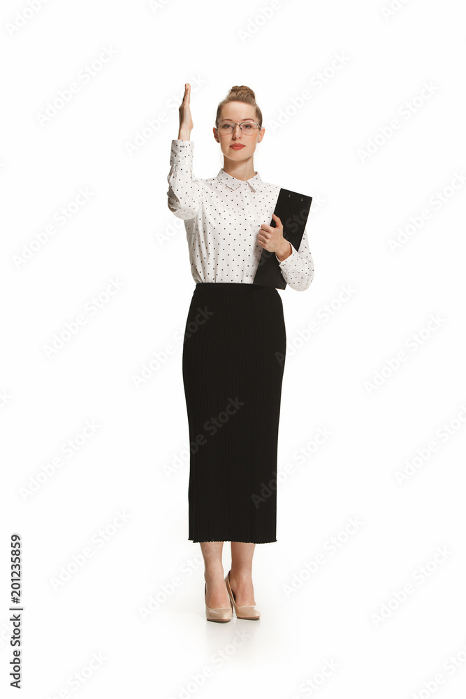 Full length portrait of a female teacher holding a folder isolated against white background Full length portrait of a female teacher holding a folder isolated against white background