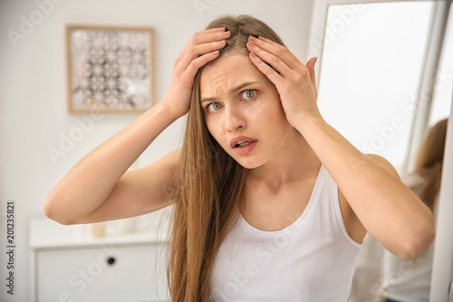 Papier peint Young woman with hair loss problem indoors