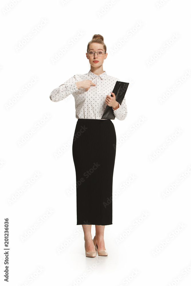 Full length portrait of a female teacher holding a folder isolated against white background Full length portrait of a female teacher holding a folder isolated against white background