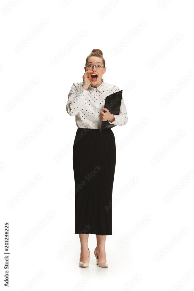 Full length portrait of a smiling female teacher holding a folder isolated against white background Full length portrait of a smiling female teacher holding a folder isolated against white background